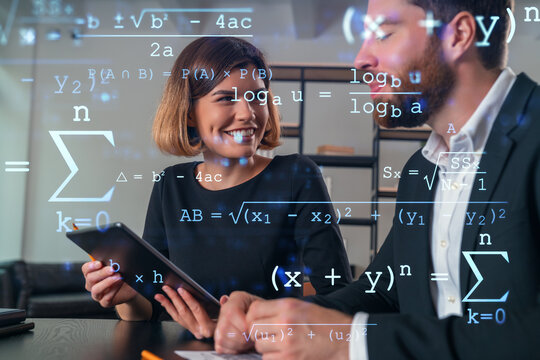 Business professionals discussing mathematical equations in modern office..