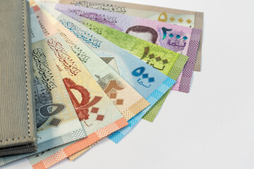 Syria banknotes of 50, 100, 200, 500,1000, 2000 and 5000 denomination on white isolated background with copy space