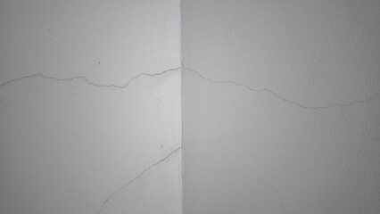 Small cracks on the white wall