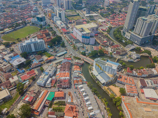 Naklejka premium Aerial drone view of big and dense Malacca City with Malaysian settlements at Melaka, Malaysia.