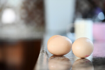 Breaking and whisking flour, eggs to prepare cake dough