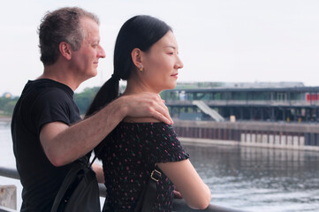 bi racial couple looking at a building in the old port of montreal