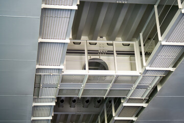 Fototapeta premium under-bridge area of a new bridge, featuring vital engineering communication systems and walkways for worker mobility, demonstrating the blend of functionality and safety in modern construction