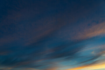 summer evening, sunset in yellow, orange and pink with clouds, background