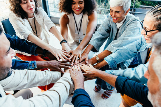 Team unity in the workplace with diverse business colleagues collaborating in the office