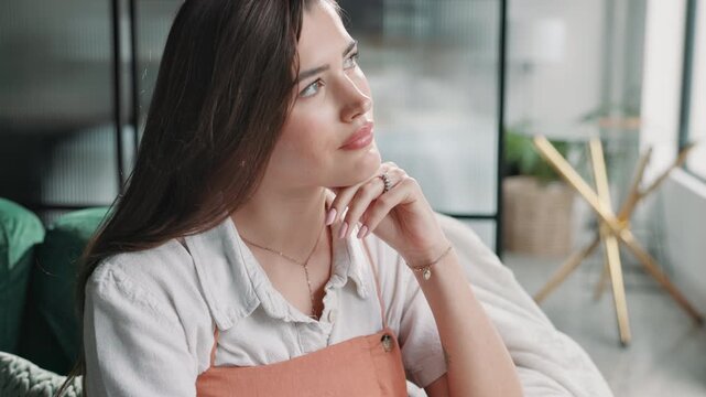 Idea, thinking and woman in home with notes for to do list, brainstorming or reminder in notebook. Relax, planning and girl in apartment writing goals in journal for insight, inspiration or schedule
