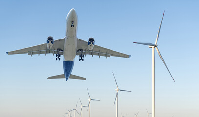 Wind turbines and plane in the blue sky