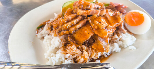Crispy pork on rice, food in Thailand