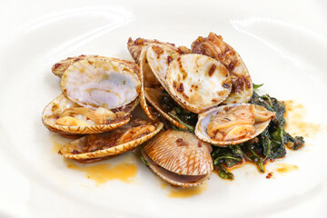 Clams vegetables in a white plate