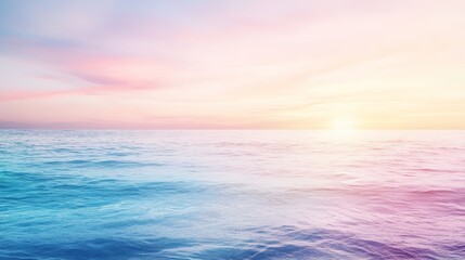 Obraz premium Serene seascape with vibrant sunset hues reflecting on the water. Calm ocean waves with a soft sky. Perfect for relaxation and tranquility.