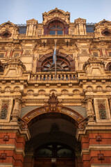 Obraz premium European architecture in Argentina. Palace with design of the second French empire. Argentine Flag 