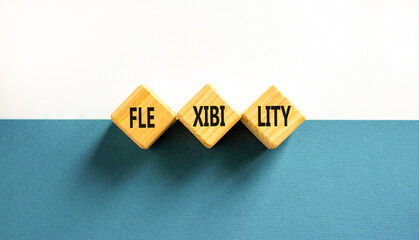 Flexibility symbol. Concept word Flexibility on beautiful wooden blocks. Beautiful blue and white...