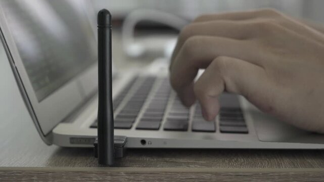 A laptop screen shows a lot of numbers and letters. The laptop is open to a page with a lot of information
