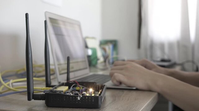 A laptop screen shows a lot of numbers and letters. The laptop is open to a page with a lot of information