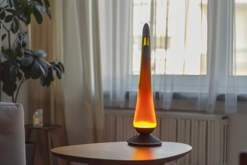 Minimalistic lava lamp on a table in a living room, against a minimalist and light interior