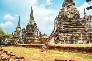 Obraz premium Three big stupas in Wat Phra Si Sanphet ancient temple in Ayutthaya historical park, Thailand, Asia. Historical Buddhist architecture on archaelogical site in ancient capital city of Siam
