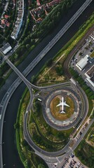 Obraz premium An airplane approaches a circular runway next to a river, surrounded by roads and greenery in an urban setting