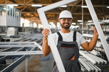 Portrait Indian male staff worker engineer supervisor in safety suit work in factory warehouse