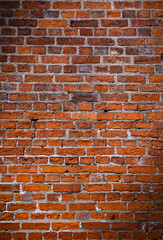 Naklejka premium Brick wall of red color, old red brick wall texture background.