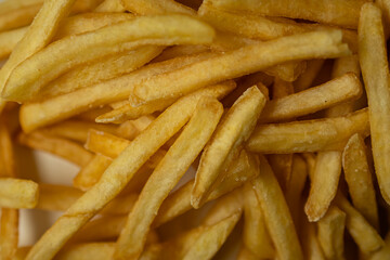 Close-up fries with grains of salt. Background. Macro. Close-up. Potatoes