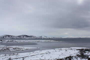Snowy landscape iceland with ocean