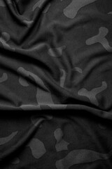 Camouflage pattern. Trendy dark gray camouflage fabric. Military texture. Dark back.