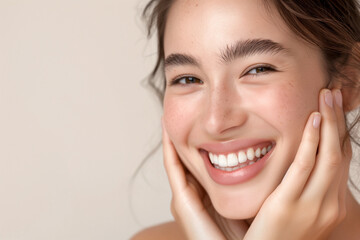 Fototapeta premium Close-up of a young woman with a radiant smile, showcasing her natural beauty and clear skin, exuding joy and confidence
