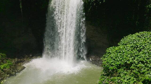 Hikong Alo Falls with water splash and mist in slow motion. Lake Sebu. Mindanao, Philippines.