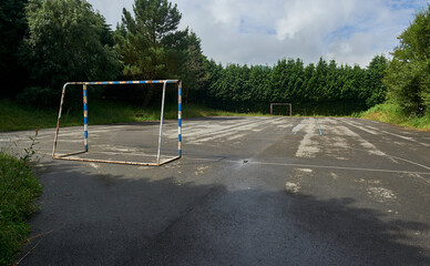 Goal and playing field on asphalt for soccer or handball