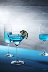 Glasses with blue alcohol cocktail ready for a party