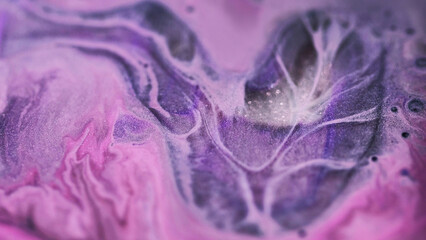 Defocused glitter. Ink paint flow. Purple pink oil emulsion black mystical bubbles background shiny...