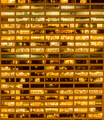 Office windows illuminated at night