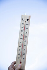 Thermometer shows high temperature in summer heat