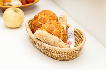 Fresh Assorted Breads in Woven Basket on Kitchen Counter