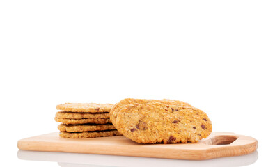 Several sweet fruit cookies on a wooden kitchen board, macro, isolated on white background.