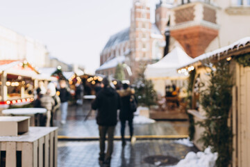 Christmas rush. Blurred area of the old town at Christmas, Christmas market. Christmas decorations on urban trees. Cracow, Poland