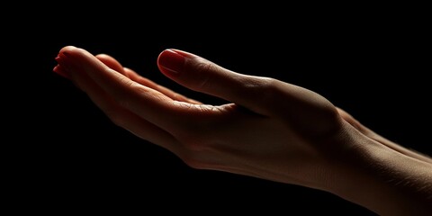 Praying Hands Embrace Hope in Solemn Darkness