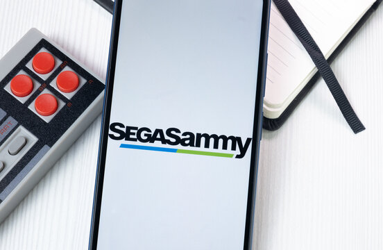 New York, USA - 1 August 2024: Sega Sammy Holdings Logo on Phone Screen, Company Icon on Display
