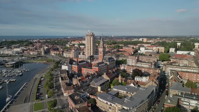  The drone aerial footage of Marina Port du Commerce and the tower of the townhall, Dunkirk, France. Dunkirk is a commune in the department of Nord in northern France.