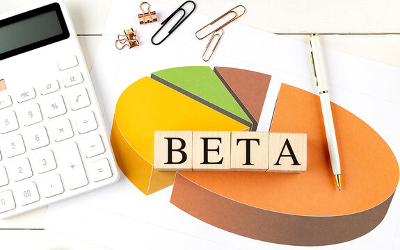 BETA word on wooden block on chart background