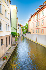 Certovka (Devil's Canal), sometimes also called the Little Venice of Prague. Czech Republic. Colorful facades of houses in a Prague neighborhood bordering the canal.