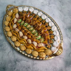 Bowl with various pieces of turkish delight lokum on a light  background. Close up