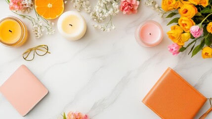 A flat lay of jewelry on a marble surface, including a wallet, candles 