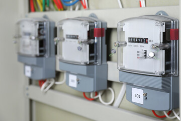 Electric meters and wires in fuse box. Energy measuring device