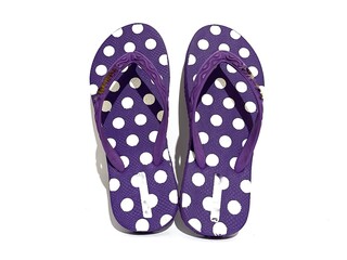Pair of purple flip flops sandal with white round Polka Dot or polkadot pattern isolated on white...