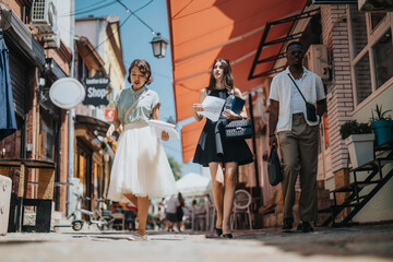 Multicultural business team walking through an urban area discussing startup ideas during an outdoor meeting.