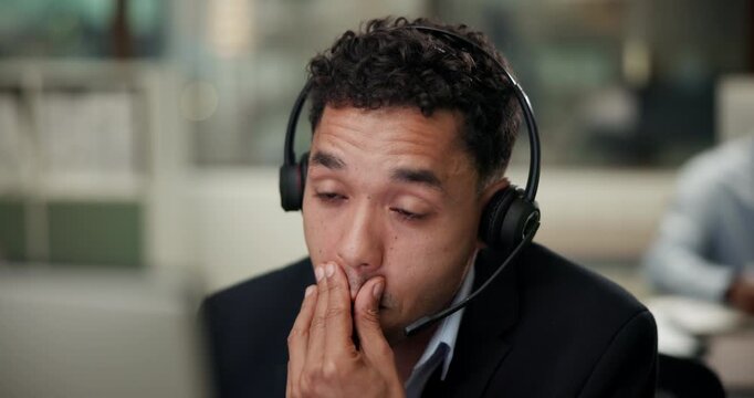 Headache, stress and man in call center office for customer service, consulting and business crm. Advisor or agent, inbound telemarketing and tired for listening, communication and faq support.