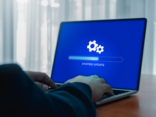 System update concept. Gear icon and updating system, loading tab bar progress operating on blue...