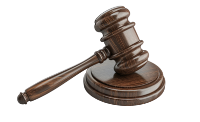 A wooden gavel on a block, commonly used in courts of law and auctions. It is a symbol of authority and justice.