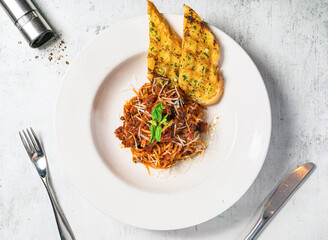 Wagyu Bolognaise Spaghetti with bread served in plate isolated on background top view of italian food